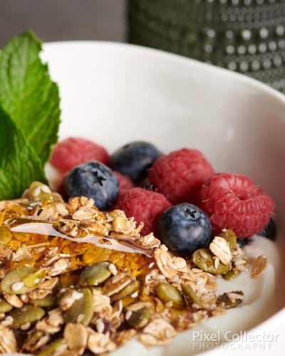 Photography of breakfast - oatmeal with honey and fruit.