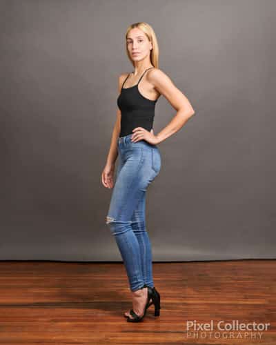 Woman standing with her profile to the camera for an acting headshot.