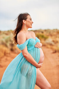 Image of a smiling pregnant lady.