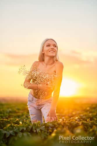 Editorial photo of woman holding flowers.